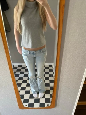  polotopp - Säljer denna gråa polotoppen från Zara i storlek xs