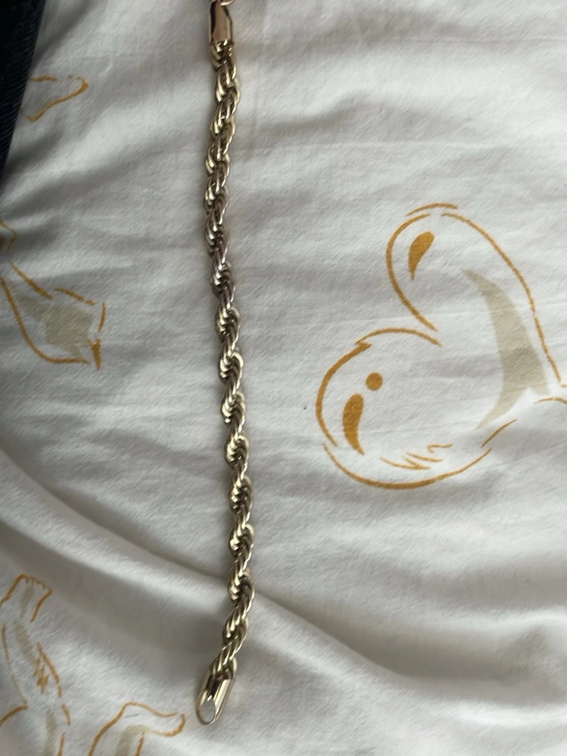 Tvinnat silverfärgat armband