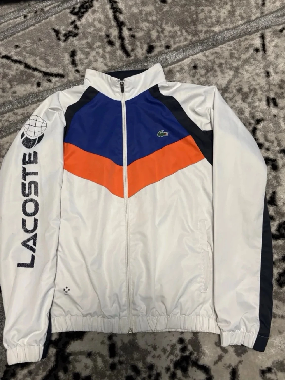 Lacoste vindjacka blå orange vit