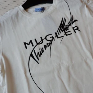 Mugler x H&M t-shirt  - Cotton t-shirt with the Mugler signature printed. Size XL but more like an L or M oversized. Totally new and selling it for 399 (website price) 