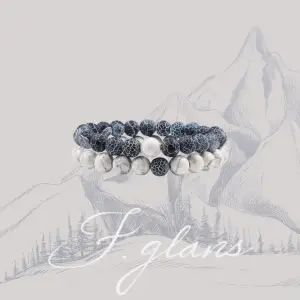 This elegant bracelet by Fjällglans features polished beads with unique veining and a sleek silver accent. Strung on durable elastic, it combines style and comfort for any occasion. Embrace a lifestyle of elegance with this timeless accessory.