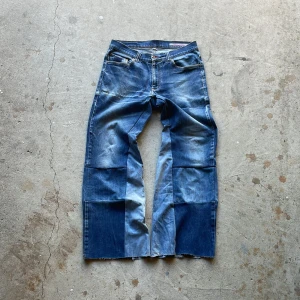 Reconstructed Flare Jeans - These jeans has been reconstructed to have a baggy flared fit with distressed details.