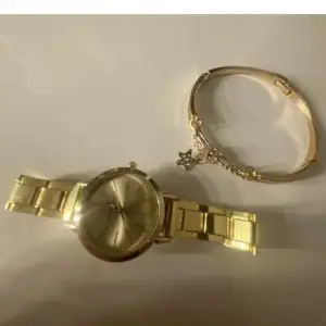 En ny klocka och ett fint smycke till den, använt 1 gång. 