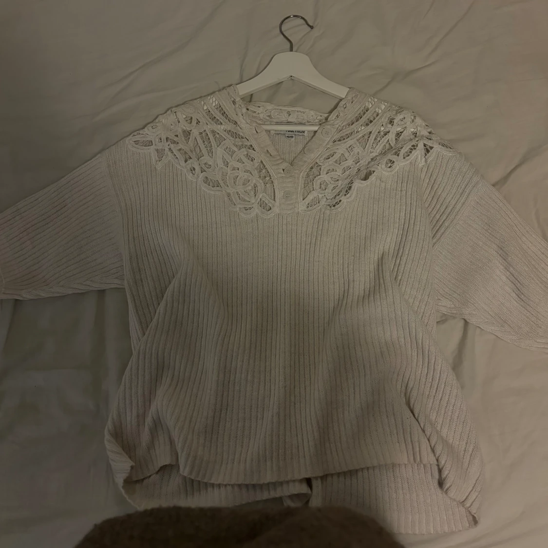 Stickad kortärmad tröja