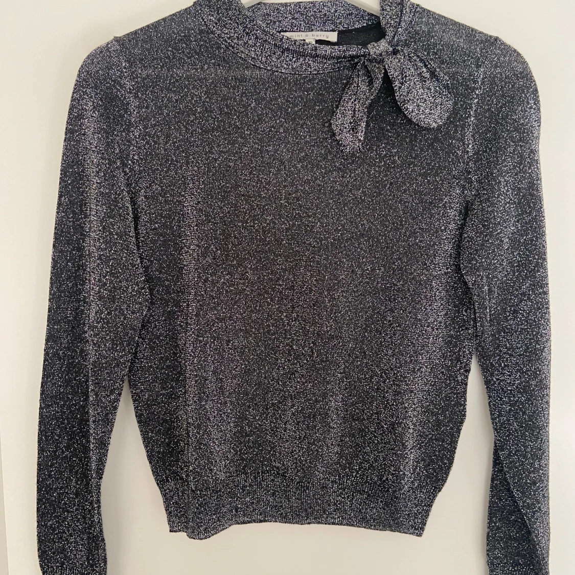 Glittrig topp/tröja