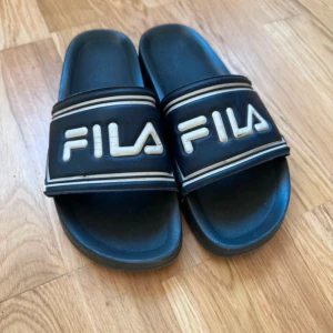 Fila Tofflor - Fina men använda 