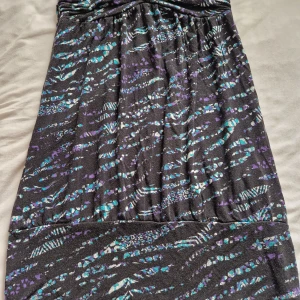 Utan arm - Passar på stranden 