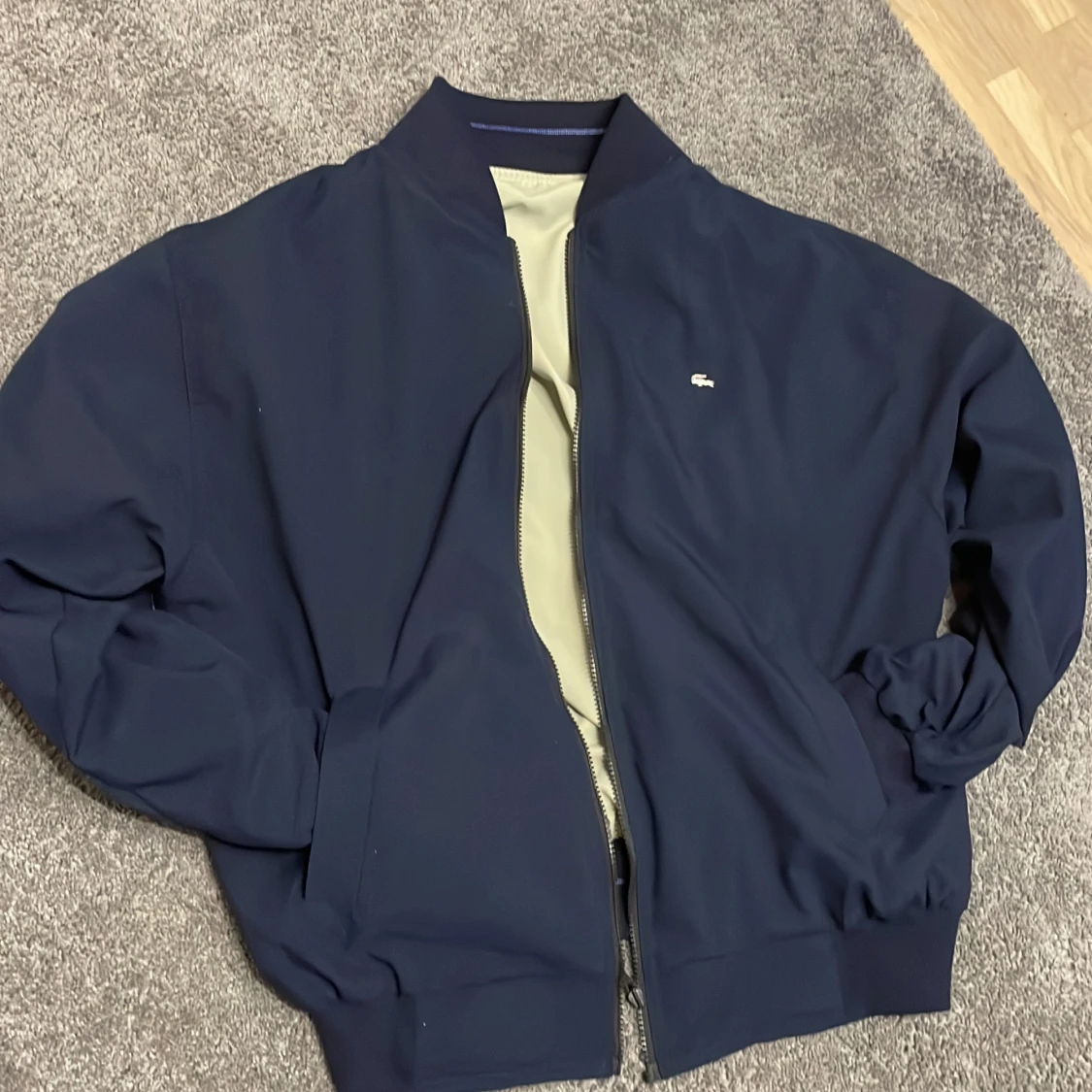 Reversibel lacoste jacka