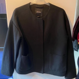 Kort kappa - Använd ett fåtal gånger.