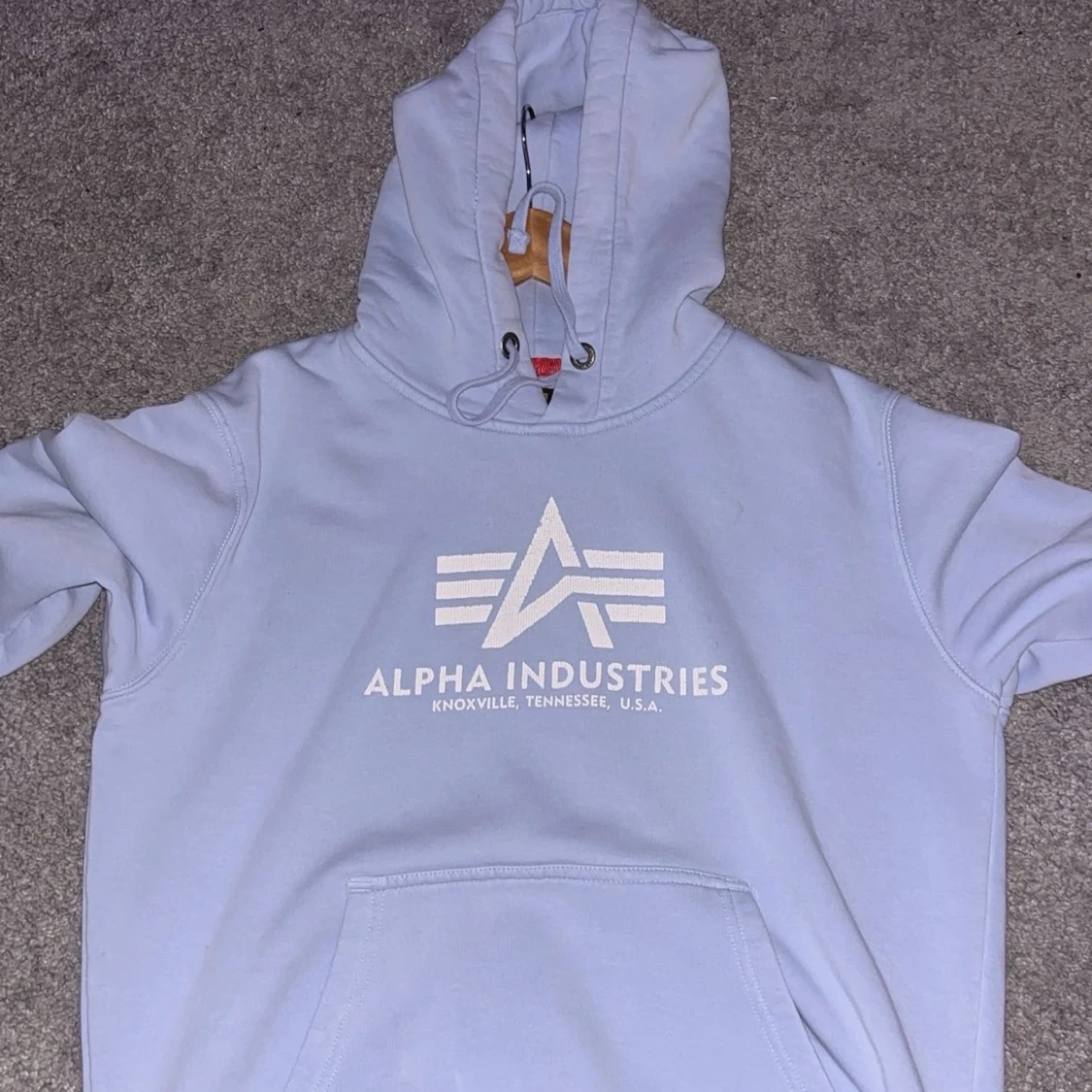 Ljusblå hoodie från Alpha Industries