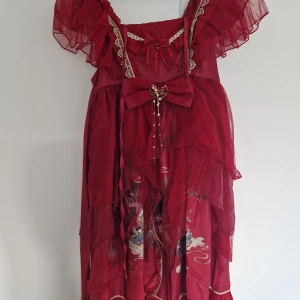 Chinese Lolita Puff Dress - A beautiful red dress that I bought at a pop-up store from the brand 熊逗酱 . The top is very short and the dress puffs out around the midriff. It comes with a scarf accessory that can be wrapped around the arms. It's brand new and has never been worn, but the tag has been removed. It's tagged as  Chinese size L, but I normally wear size S and fit in it. If you have any questions or want more pictures feel free to reach out!