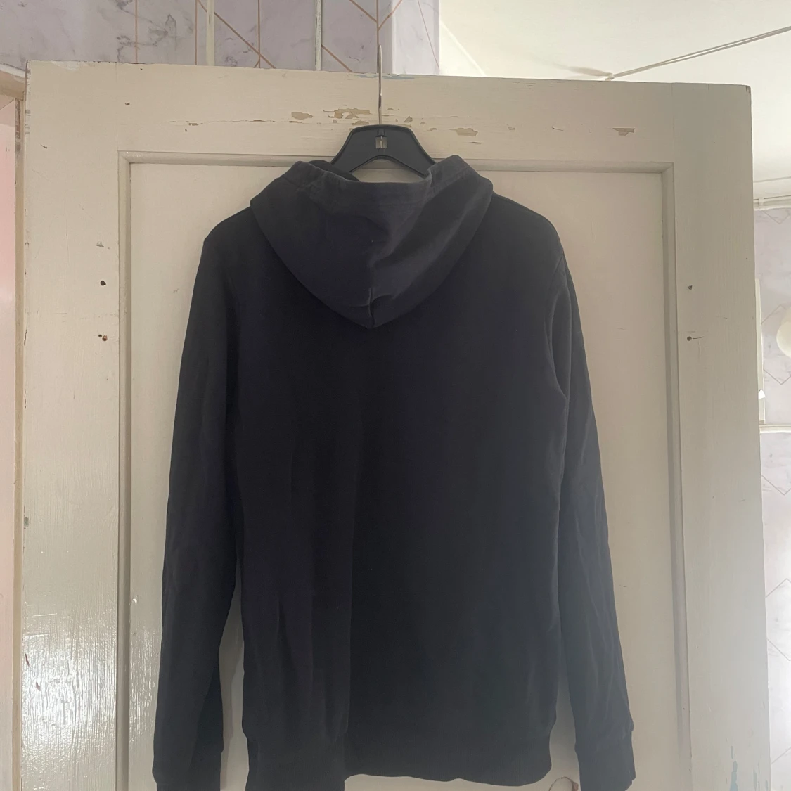 Svart hoodie från Peak Performance - 90