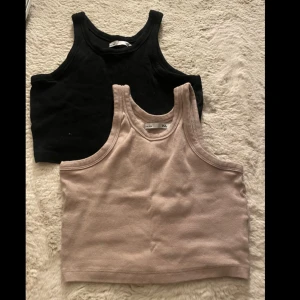 två st linnen  - en beige och en svart linne i storlek M 