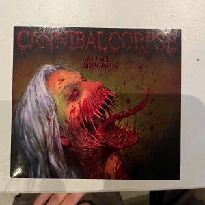 Cannibal Corpse cd - Albumet 'Violence Unimagined' av Cannibal Corpse.