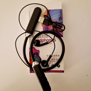 Wireless BT neck hanging headphones - Brand new unused wireless bluetooth headphones with digital display, DSP ENC intelligent noise canceling, hd sound, auto pairing. 