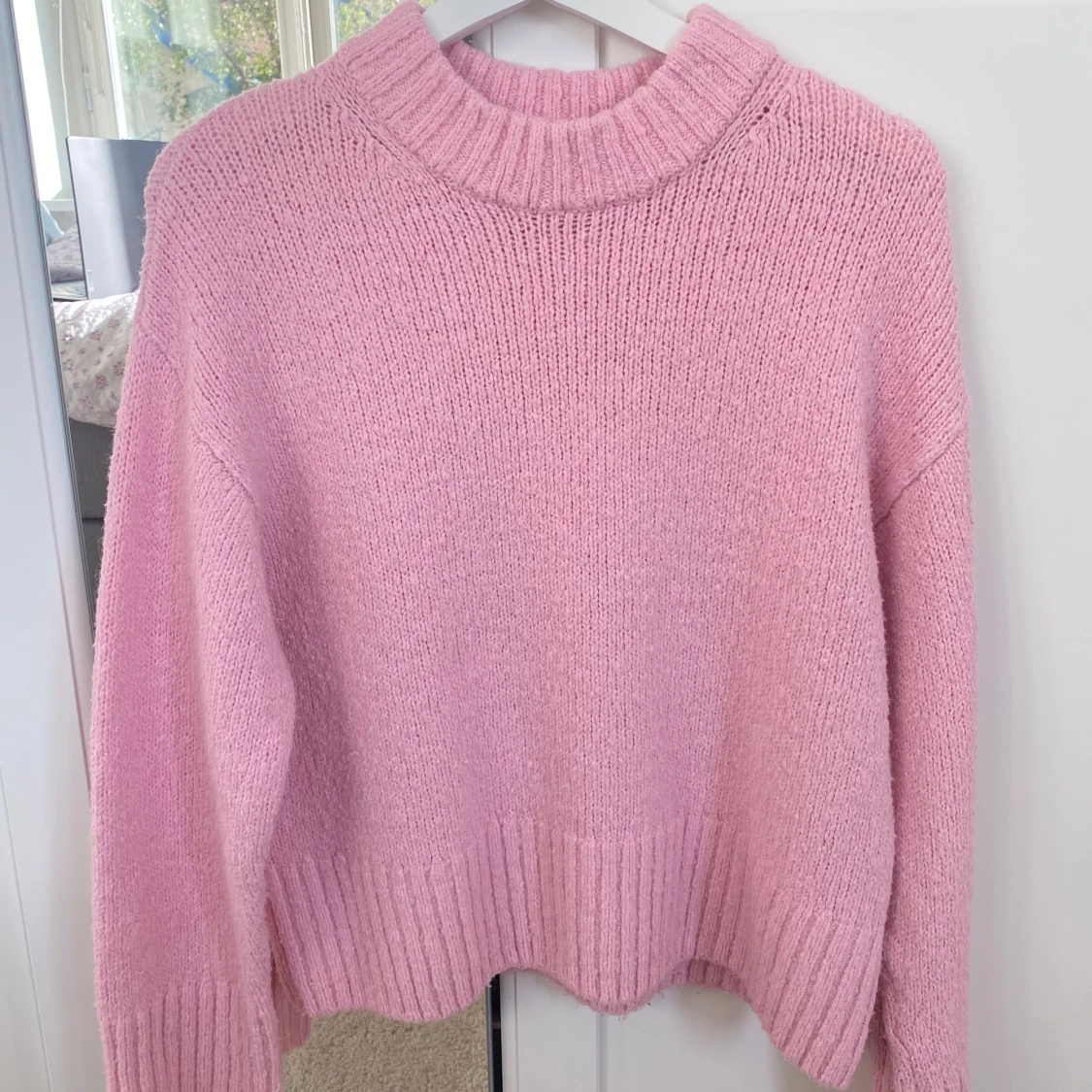 Rosa stickad tröja