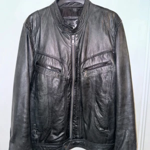 Leather Jacket - Nice and heavy leather jacket,  Not so sure about the size, didn’t understand the tag but the jacket is big so maybe L. Want more pictures PM