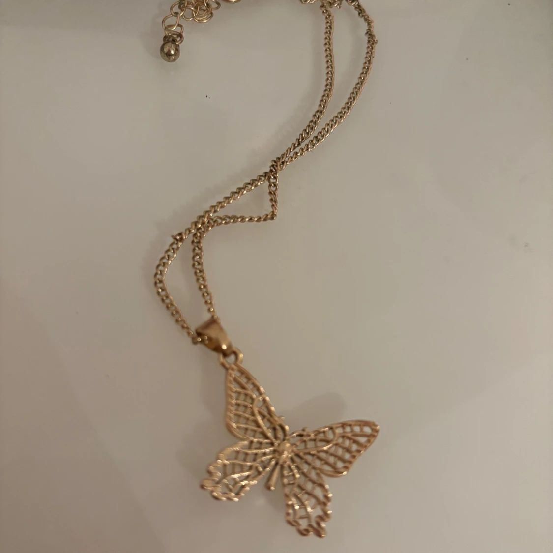 Guldigt fjärilshalsband - 2