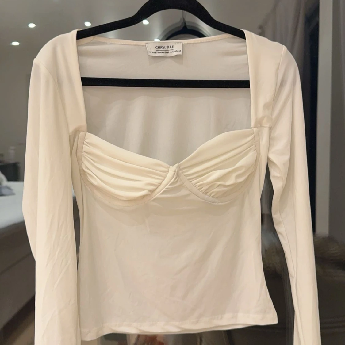 Vit långärmad topp från Chiquelle