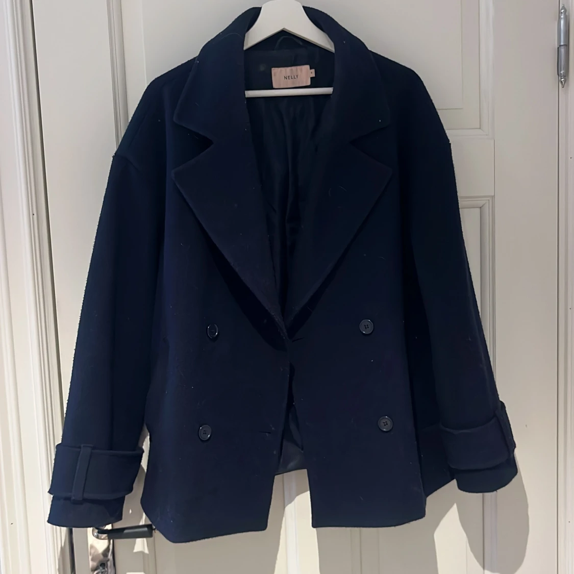 Mörkblå kappa från Nelly