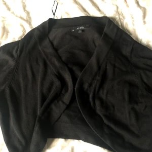 En kofta - Aldrig använd