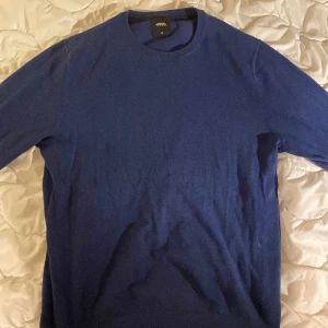 Tröja från Burton - Blå stickad tröja från Burton. Hyfsat skick.