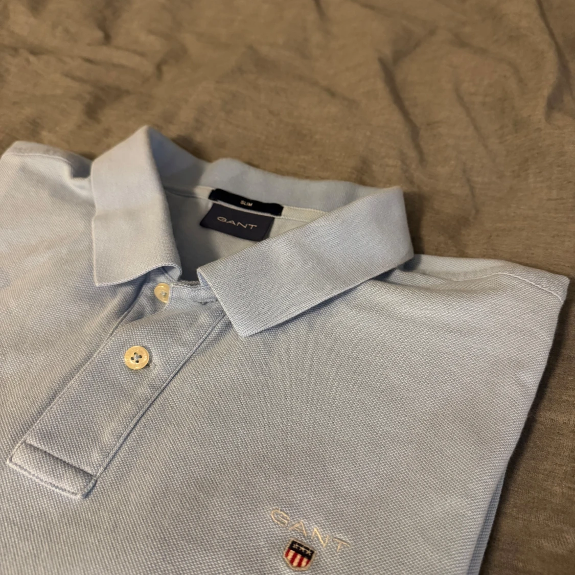 Ljusblå pikétröja från GANT