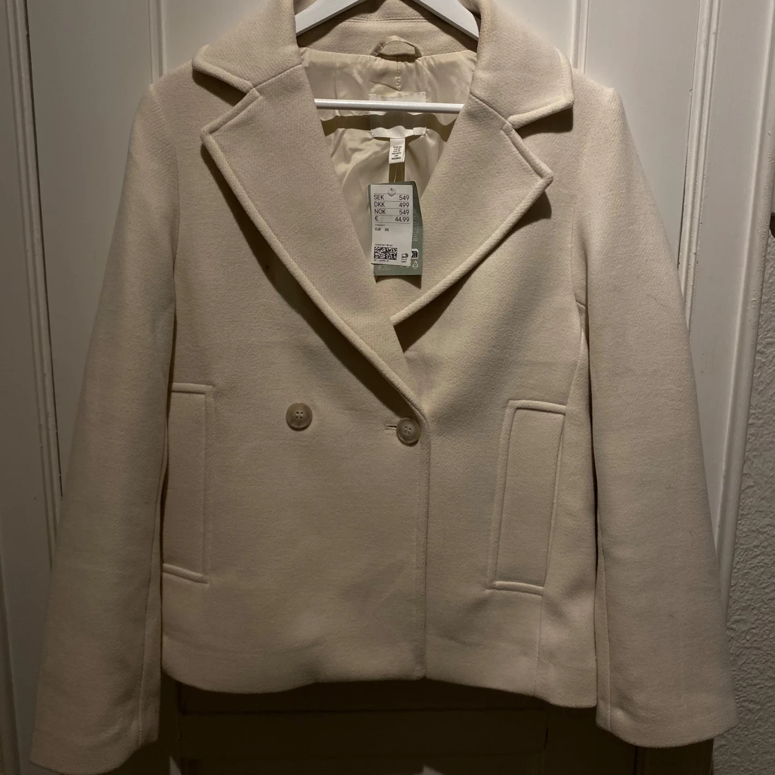 Beige kappa med knappar - 90