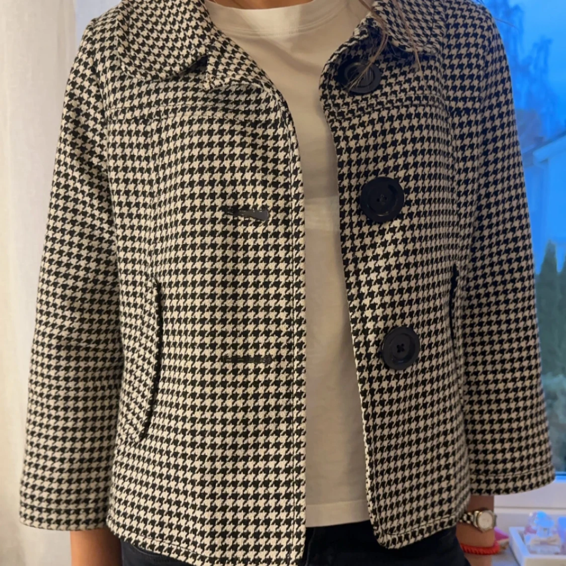 Svartvit rutig kappa