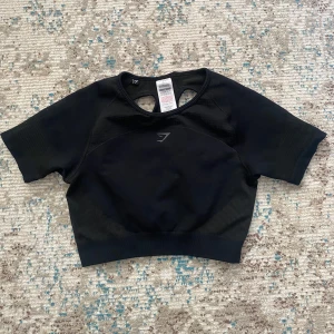 Träningstopp gymshark - Svart träningstopp från gymshark. Fint skick🤍