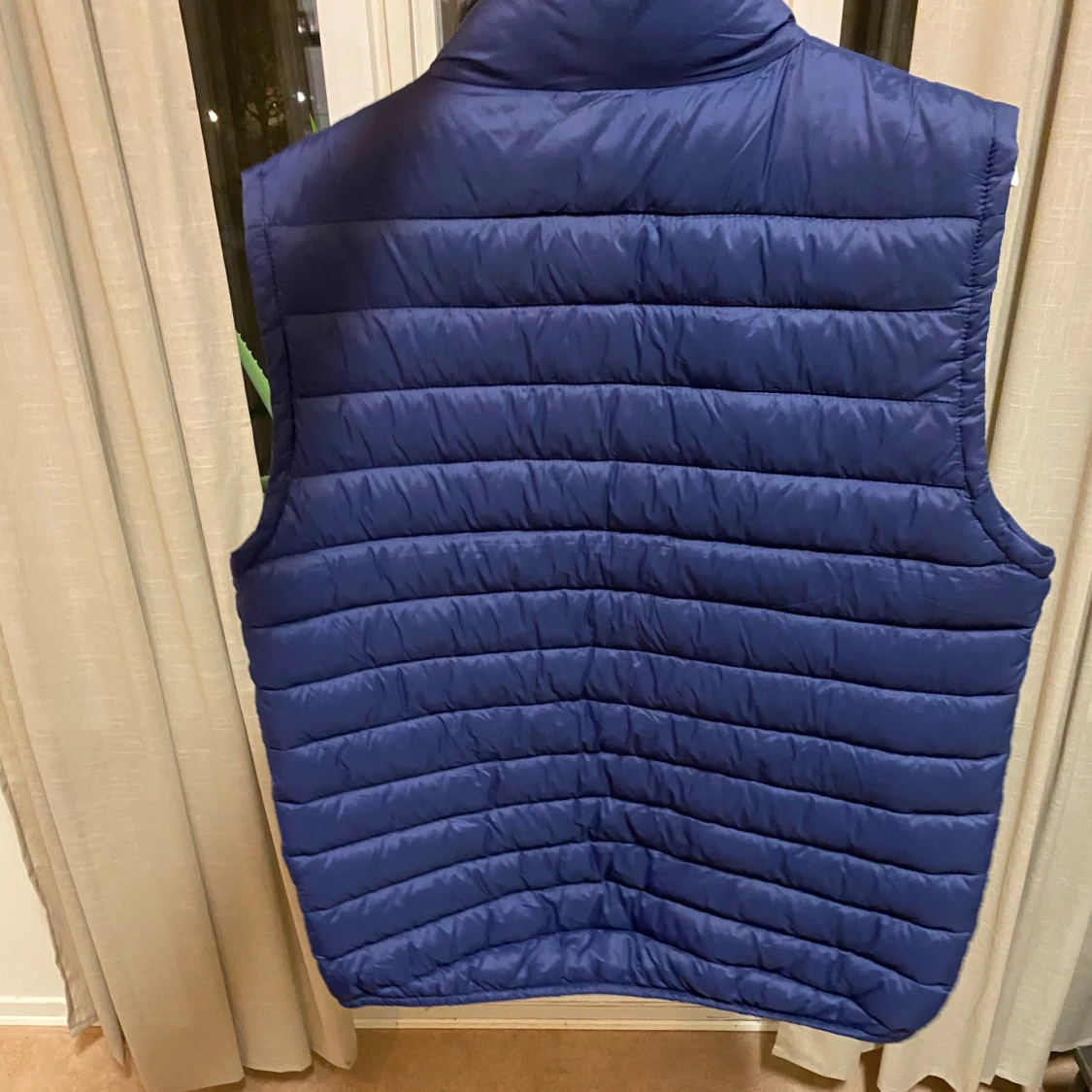 Blå quiltad dunväst - 90