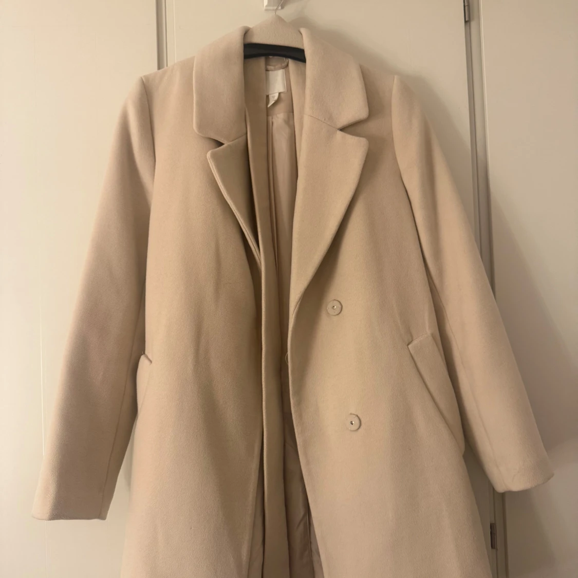 Beige kappa från H&M