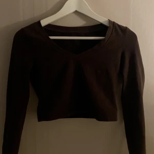 Topp - En brun topp, storlek Xs. Bra skick. 