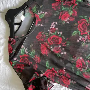 See through black dress with red roses, used once. Size works for M and S sizes 