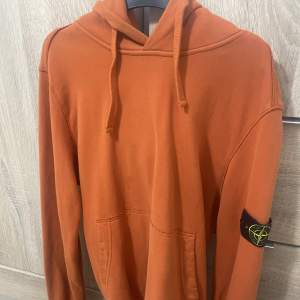 Orange stone island hoodie 