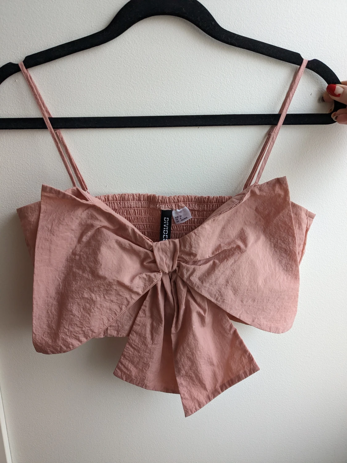 Rosa topp med rosett