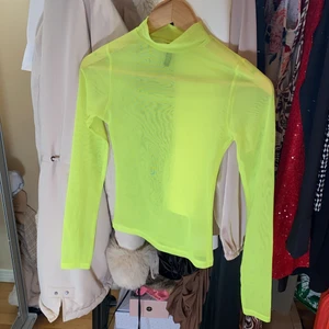 H&M - Neon gult plagg med långa armar och genomskinlig 