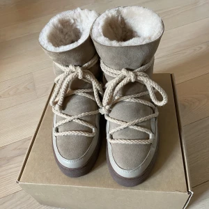 Inuikii Classic Wedge - I am Selling my beautiful Inuikii Classic Wedge boots in beige. They are in perfect condition and have only been worn three times. They were bought for 3153 sek , but I am willing to sell for 2100 sek. They are a size 39, but will fit a size 38 as well.
