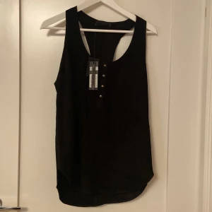 Diesel black gold leather tank top - Diesel black gold lamb leather (picture 3) tank top. Has never been work the tag is still on. Comes with an extra button 