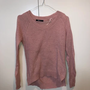 Tunn stickad tröja - Rosa tunn stickad tröja från Gina.