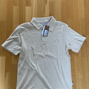 NN07 Piké ny - Piké i frotté från NN07, helt ny med tag kvar