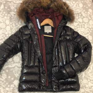In a really good condition, worn one winter I am a size xs but it fits a slim s. It hugs the body, is really warm and has gorgeous burgundy accent. A* replica, if you scan the inner tags it takes you to the official moncler website, extremely good copy