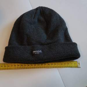 23cm width lightly used and in good condition elastic black hat