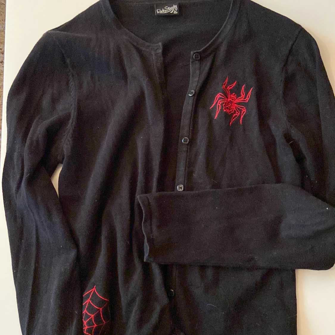 Kofta med spindel märken