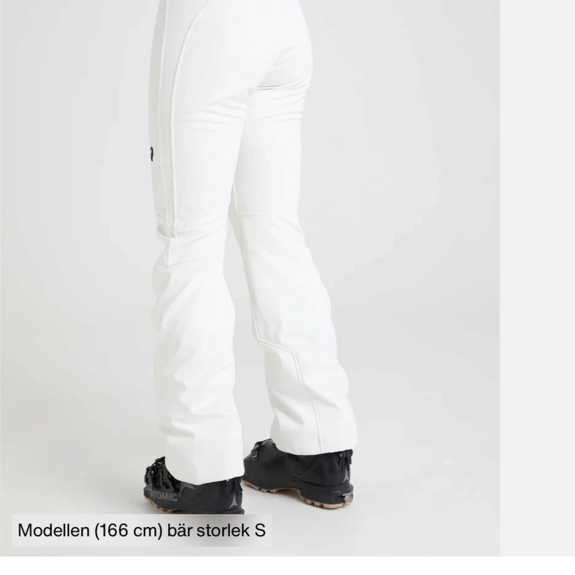 Vita täckbyxor med markerade sömmar - 1