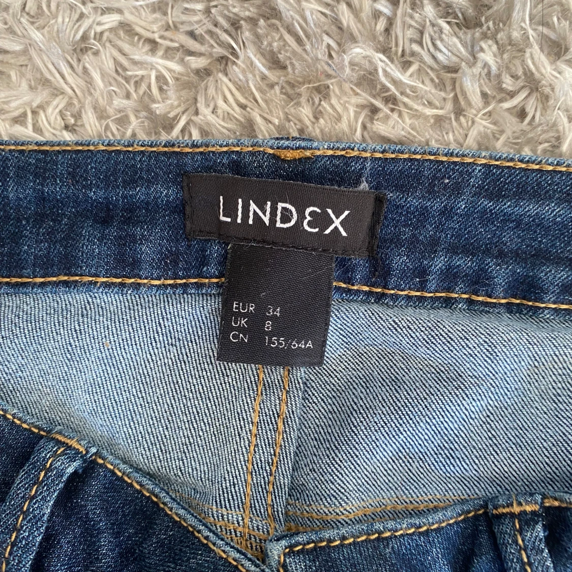 Blå bootcut jeans från Lindex, stl 34 - 2