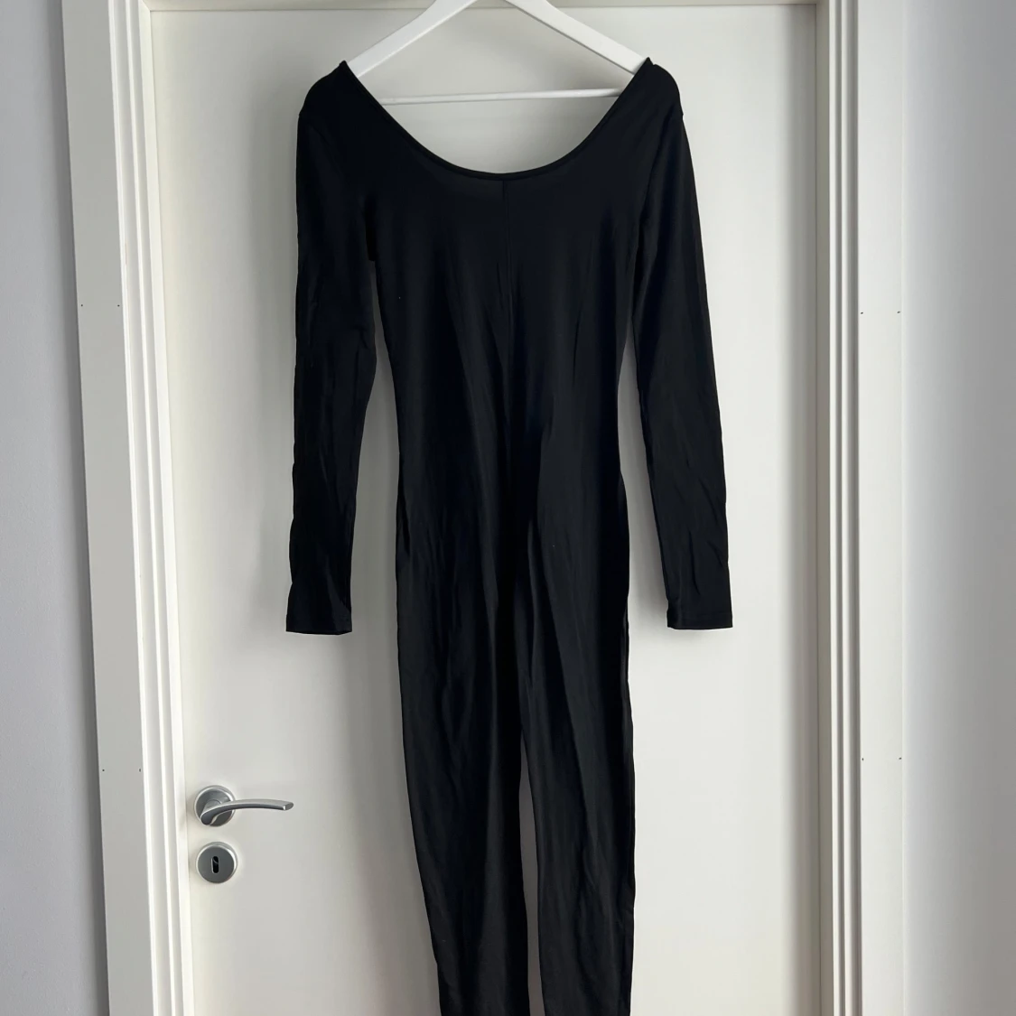 Svart långärmad body i polyester - 1