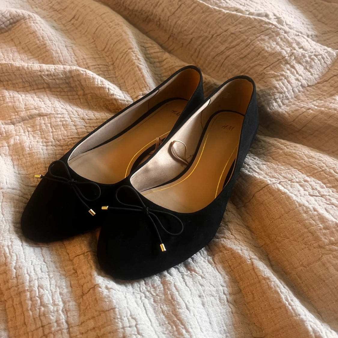 Svarta ballerinaskor med rosett H&M