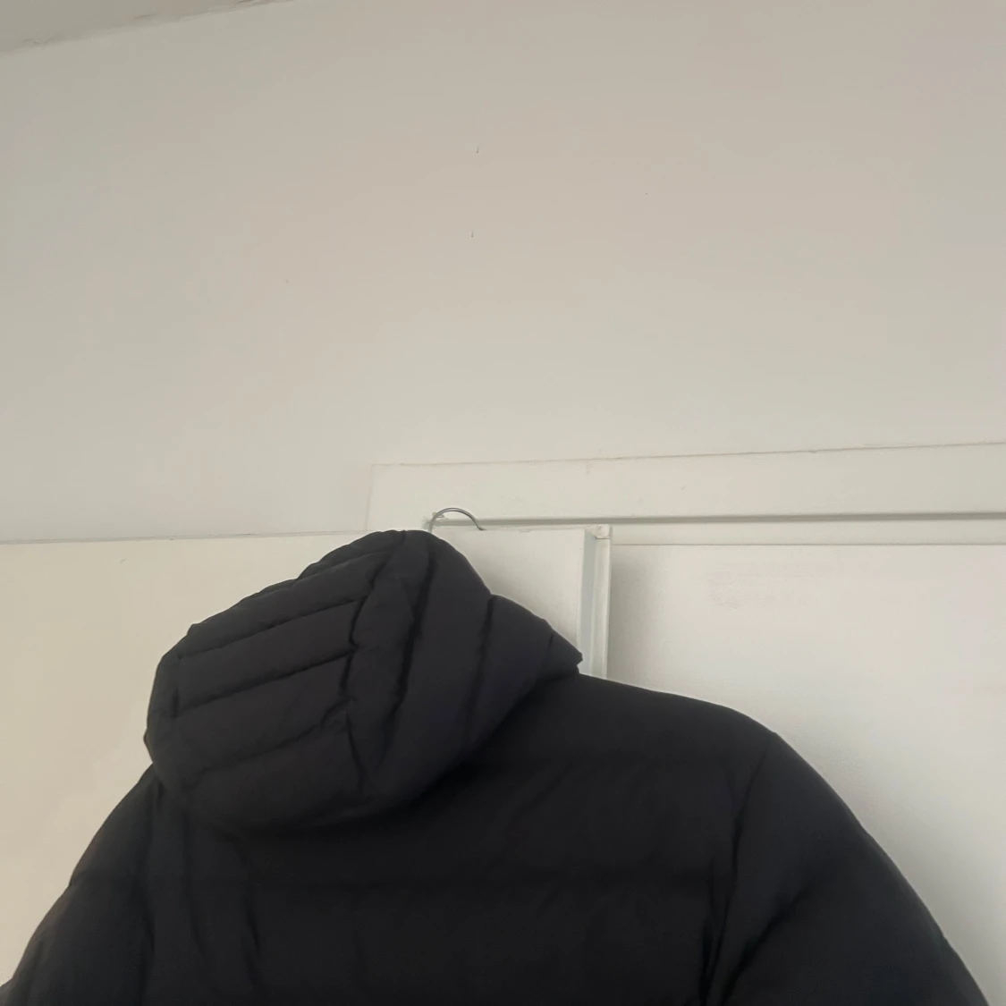 Svart dunjacka Peak Performance - 1