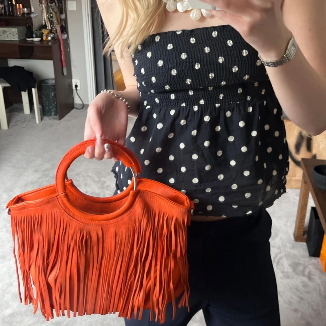 Orange handväska med fransar